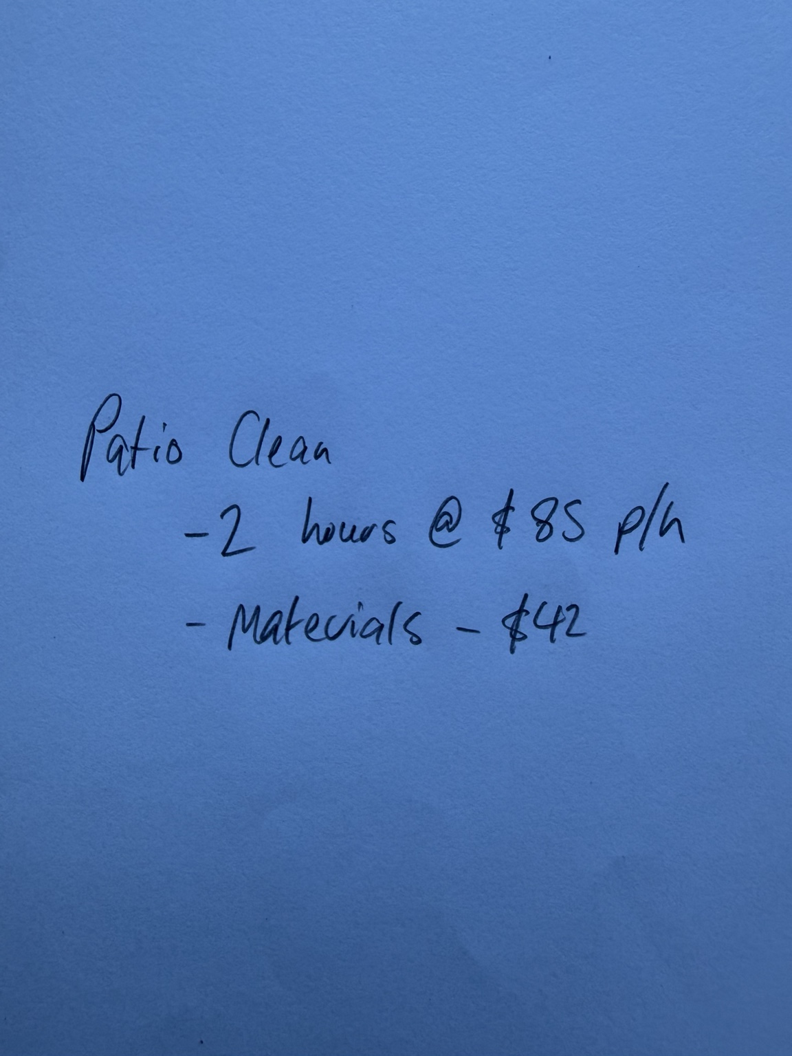 Handwritten note on blue paper: patio clean, two hours at $85 per hour and $42 in materials